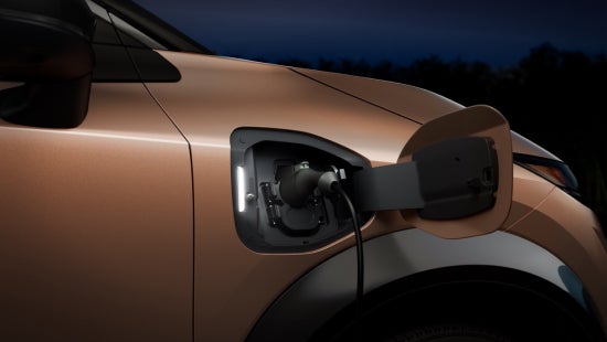 Close-up shot of ARIYA plugged-in with charging cable | Stevens Creek Nissan in Santa Clara CA