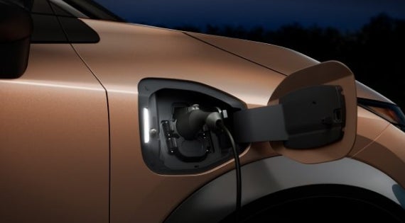 Close-up image of charging cable plugged in | Stevens Creek Nissan in Santa Clara CA